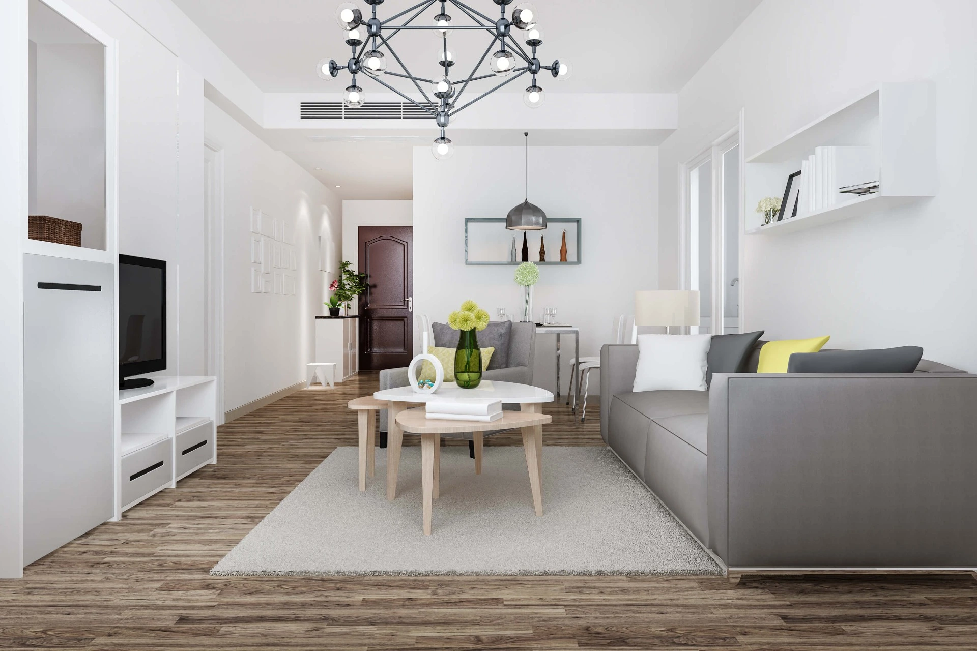 Sala soggiorno con mura bianche e divano grigio